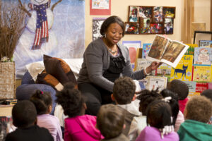 teacher leading storytime with preschool children